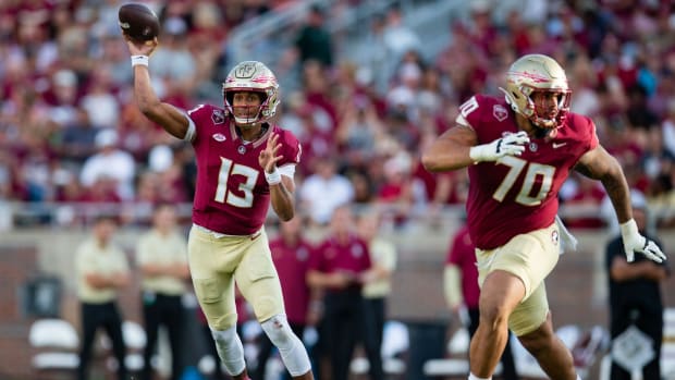 Florida State Seminoles quarterback Jordan Travis (13) passes to his teammate. The Florida State Seminoles defeated the Virginia Tech Hokies 39-17 at Doak Campbell Stadium on Saturday, Oct. 7, 2023.